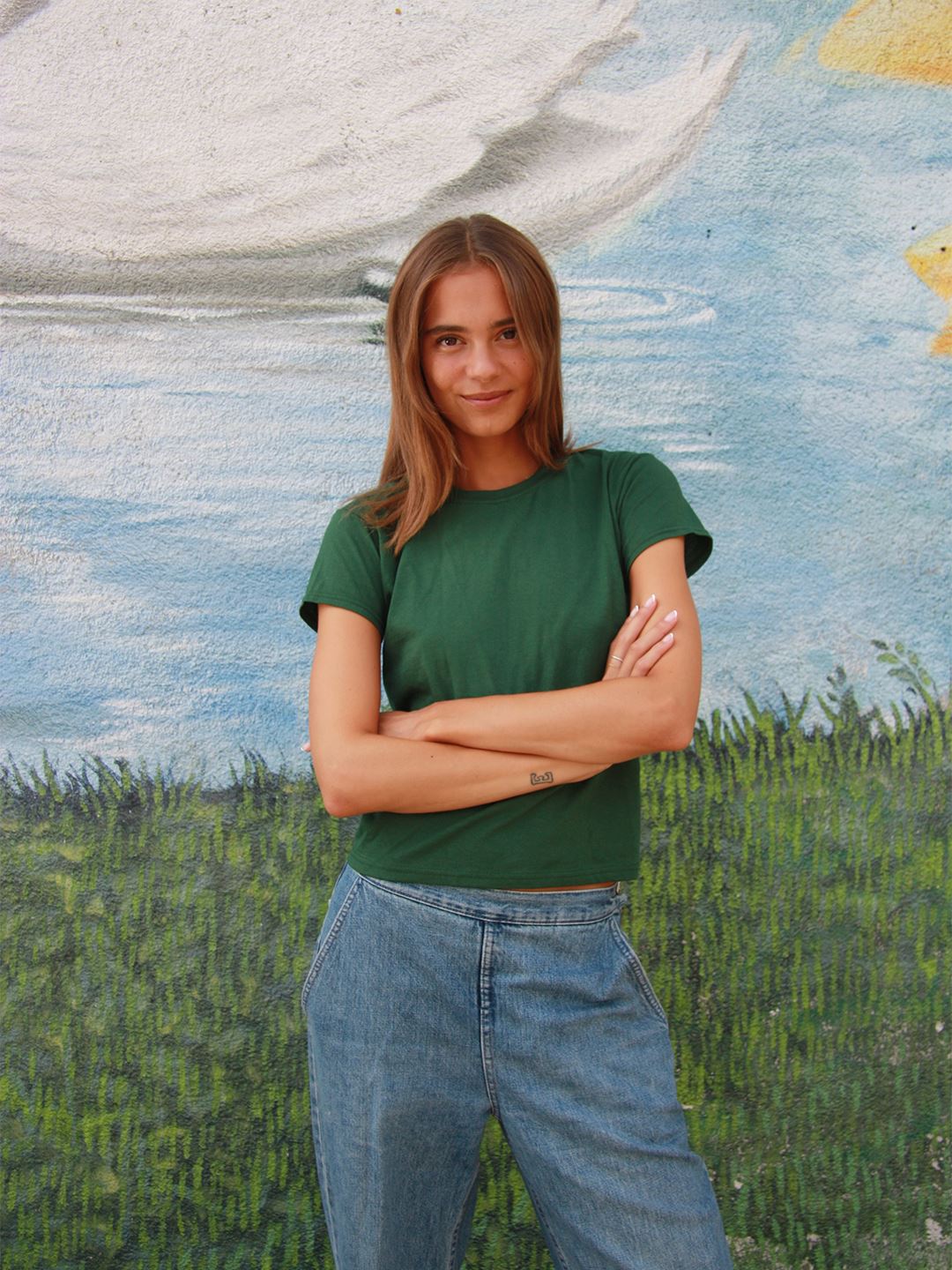 Sarah er 189 cm høj og bruger størrelse M (7-8 år) | mørkegrøn